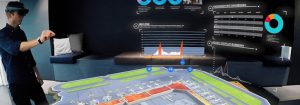 hombre con gafas de realidad aumentada gestionando un escenario virtual de un aeropuerto