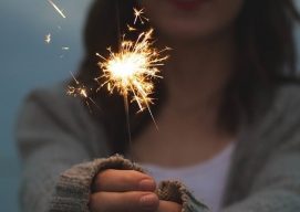 Image of a girl with a flare in her hands as a celebration