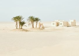 white concrete house in the desert