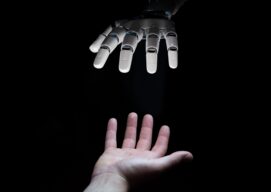 A bionic and a human going to touch their hands